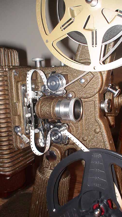 White Film Reels Rotating. Old-fashioned 8mm Movie Projector