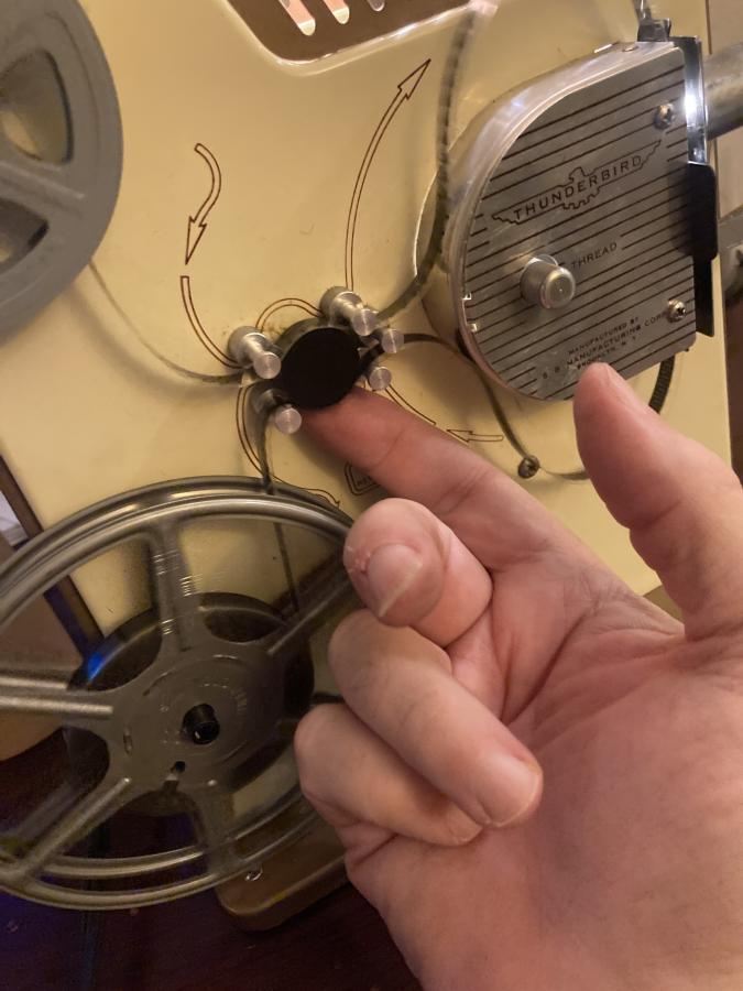 Angled view of Vintage 8 mm Movie Projector with Film Reels. Film